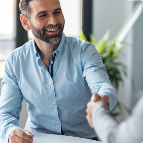 Men in blue shaking hand
